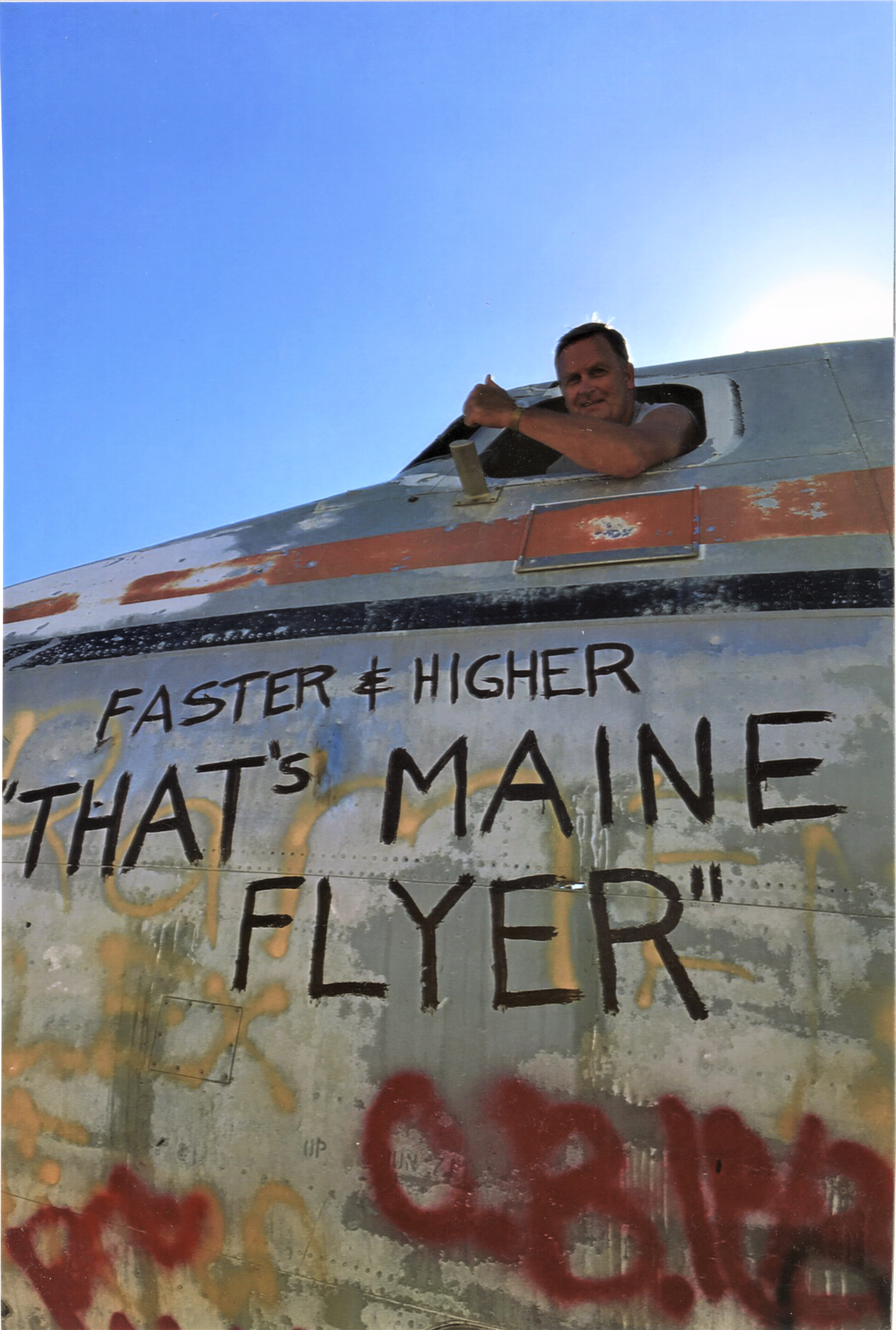 Len Johnson in the window of the Maine Flyer
